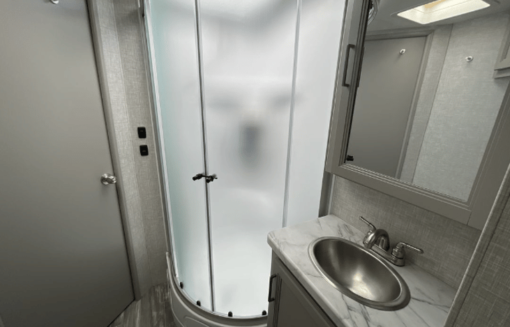 Walk thru bathroom and shower, that connects master bedroom to common area.