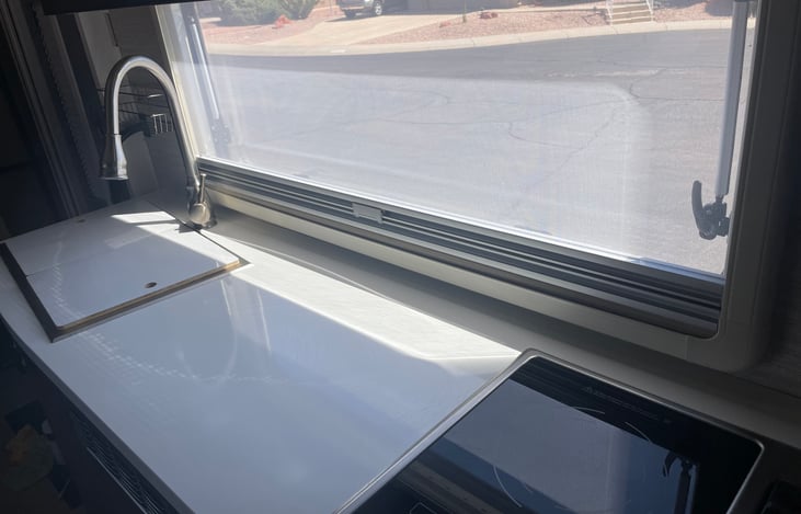 Stove top is both induction and gas burner.  Microwave (below stove top) is also convection for baking (yummy cookies).