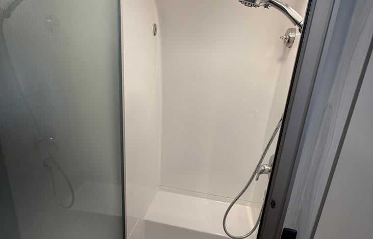 Shower. For us tall folks, we get used to sitting on the bench.