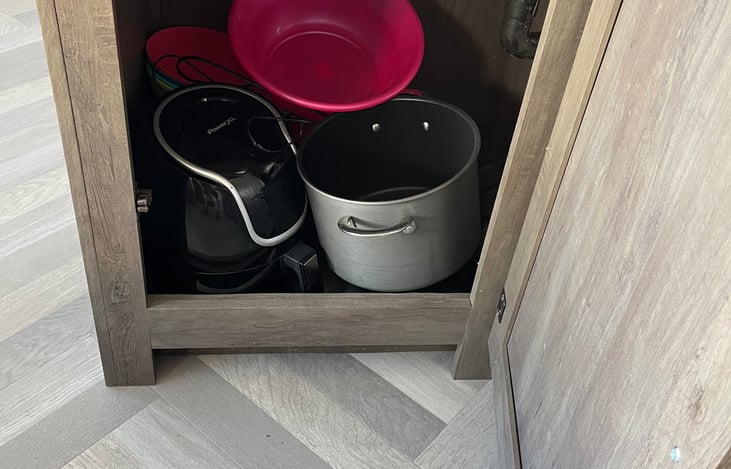 Air fryer, cookware, and dishware included.