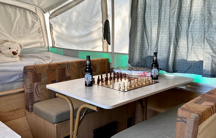 Table easily seats 4 adults. Converts to bed.