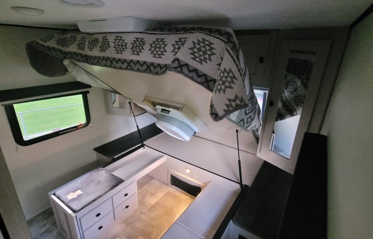 Tons of storage under master bed that lifts up