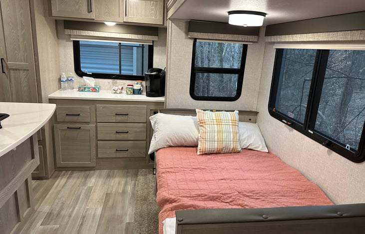 Dining table folds down into a full bed, for 2 people. Table has to be pulled out and pushed down at the same time to be closed for bed to be made. Cushions should be removed while transitioning.