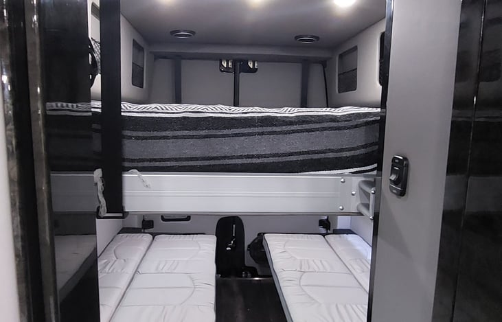 Benches pull out into bunks, and the loft is self supporting.