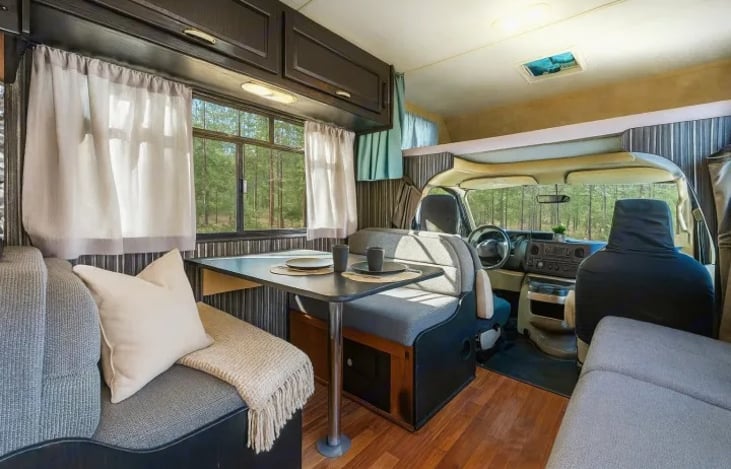 Festival mornings or family dinners, this dining area fits them all — comfortable, functional, and part of a pet friendly RV that sleeps 6