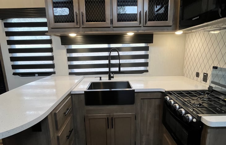 deep sink, overhead storage, cook top, and microwave