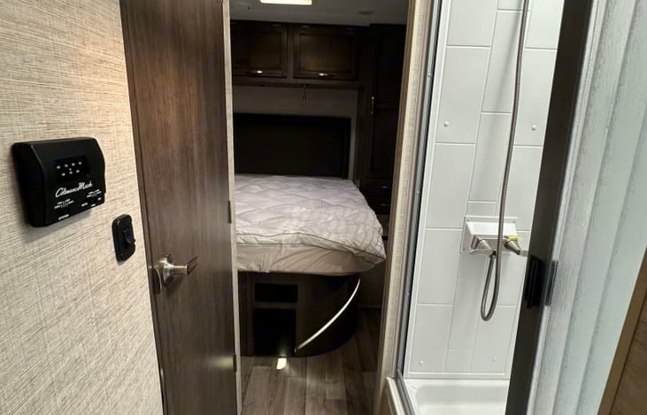 Split bath.  The toilet and sink are on the left, and the shower is on the right.  Privacy is provided by a pocket door and the bathroom door also opens up and can close the bedroom off.