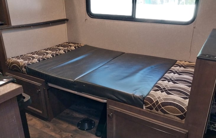 The table becomes a fourth bed (for a 5 person to sleep on).