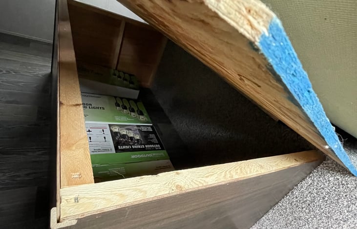 Storage area under mattress