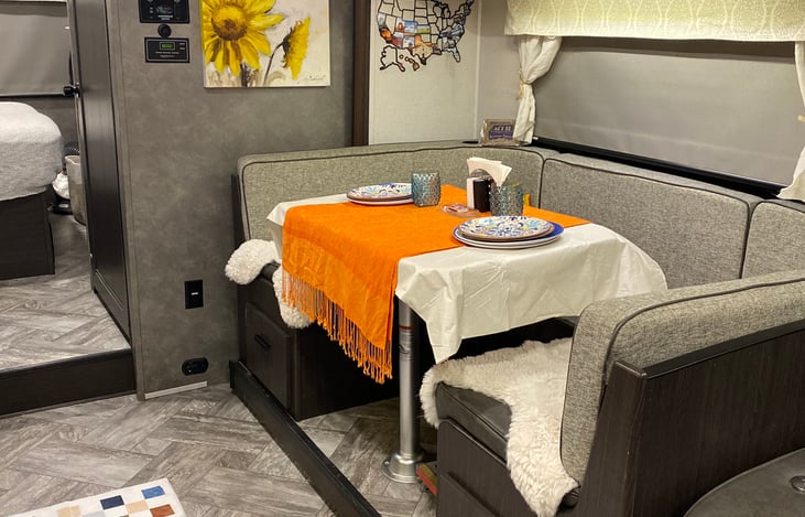 The dining table seats 4 adults comfortably.