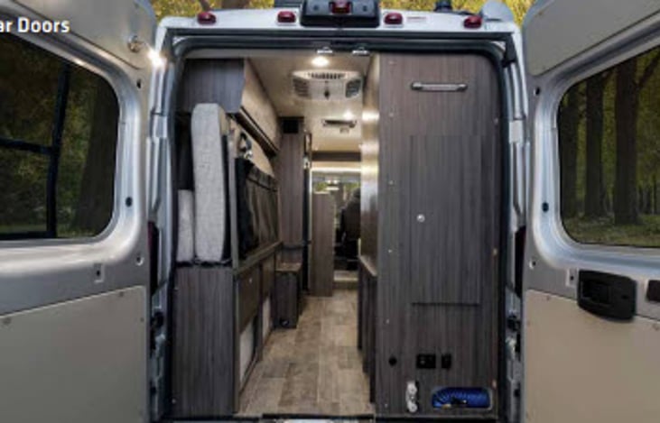 The back of the van has a screen that can be zip up.  This will allow airflow but keep the bugs out.
