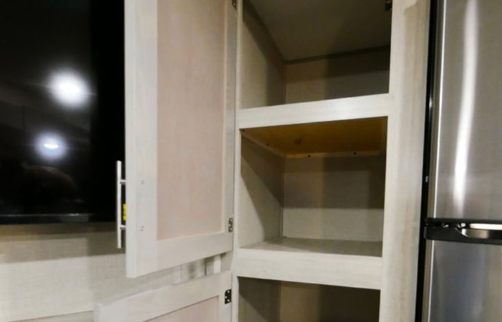 Pantry, great for snacks and cereal ... please don't use for heavy items like cases of water/beer or heavy items as the shelves are typical RV thin shelving. plenty of outdoor storage & 120qt. cooler.