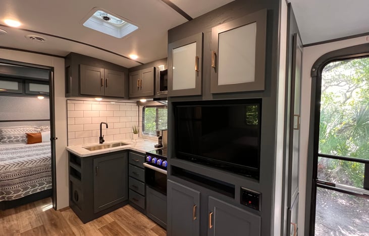 The living space is great for family time or entertaining! The 32” HDTV has a FireTV for streaming apps and an indoor/outdoor sound system.