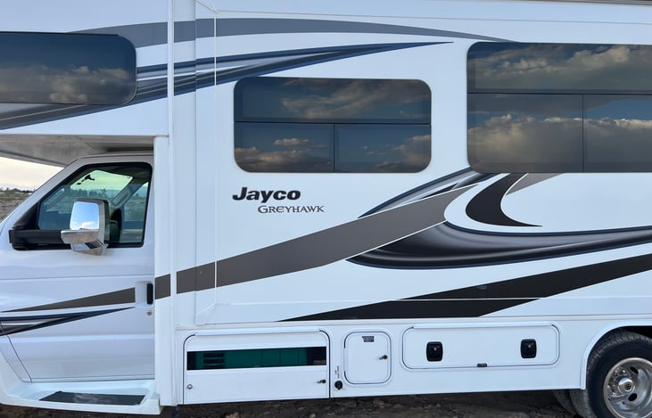 Service side. Electrical, sewage, water controls, outdoor shower, extra storage and generator.