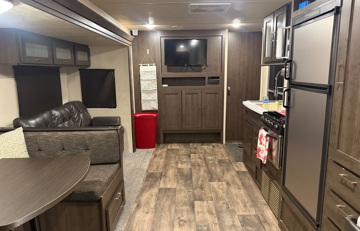Three storage cabinets above couch.