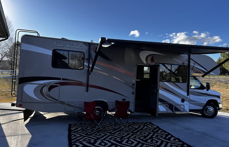 30' Camper with Awning, Outdoor Rug and Chairs