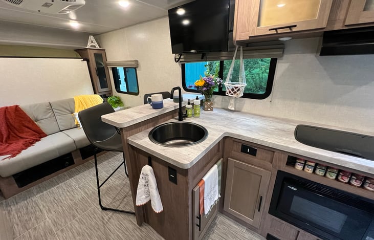 Enjoy coffee/tea while relaxing at the breakfast bar overlooking the kitchen with the perfect view out the window.