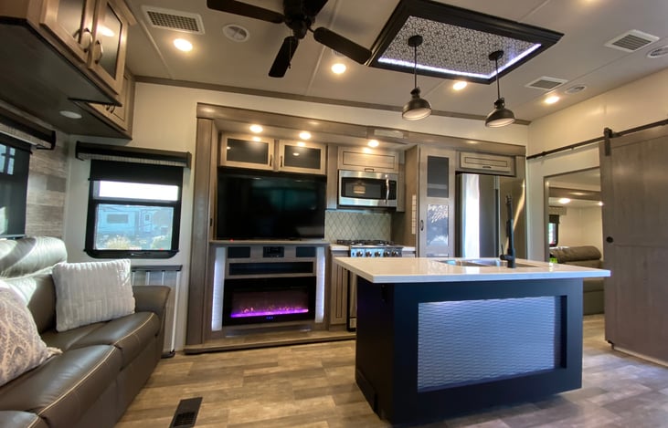 Living area with fireplace and tv