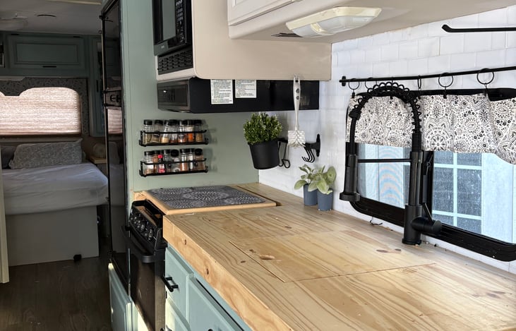 Kitchen with farmers sink and custom counter top