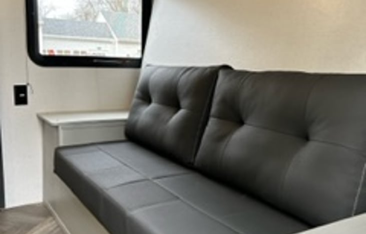 Couch drops down to queen size bed.