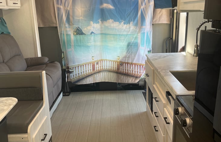 A beautiful beach scenery, or a hideaway curtain for the kids to enjoy their "fort" in the upper bunk area.