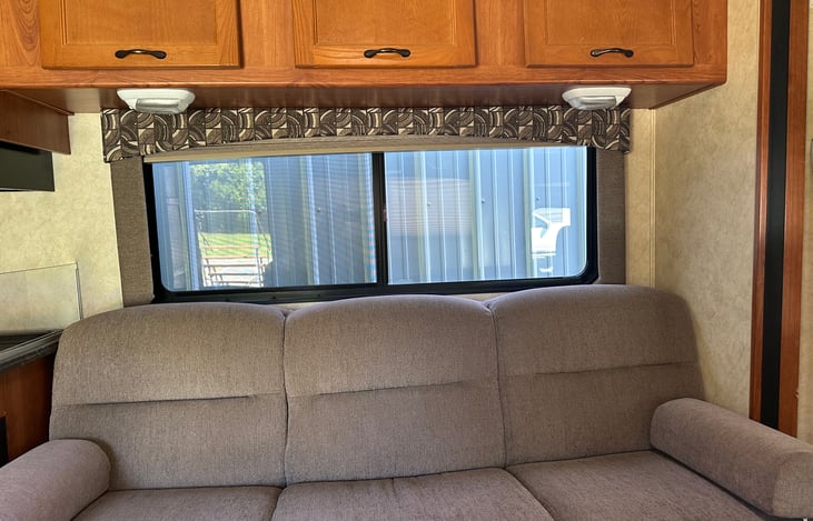 Storage cabinets available above sofa