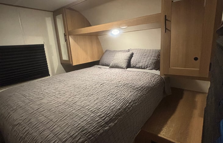 Main bedroom: Queen size bed with outlets on both sides. TV in room