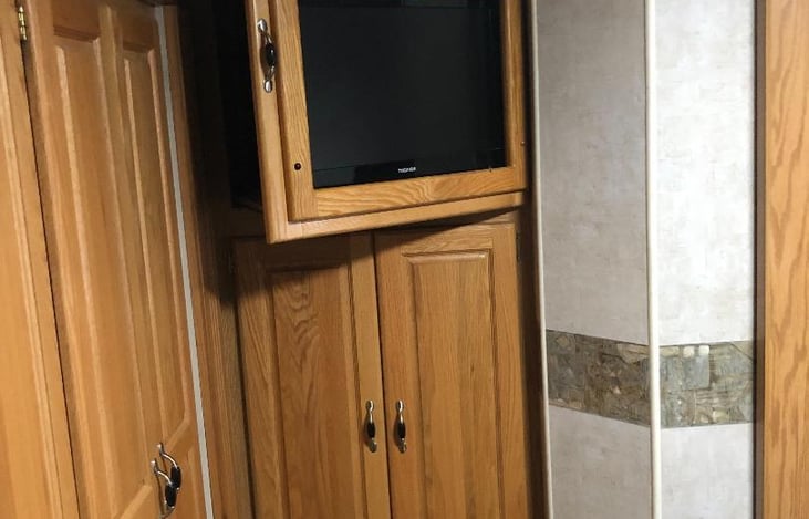 TV swings for viewing in bed.