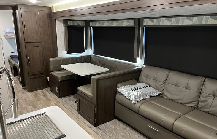 Dinning table and couch fold down to make small beds