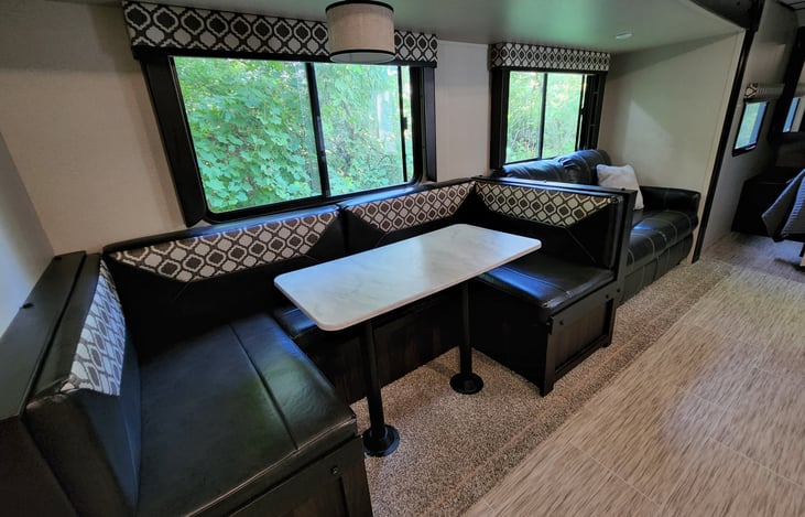 Large dinning room table that converts to a full size bed.