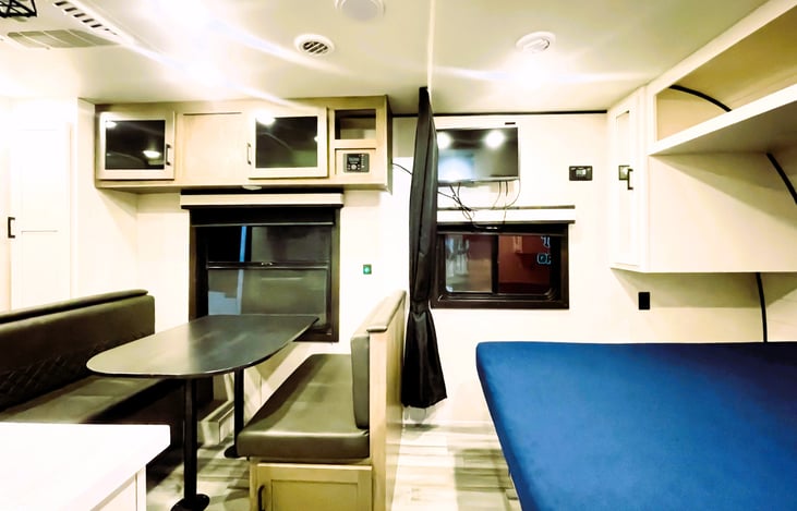 Open and cozy — the convertible sleeping space in your Jam Caravan by Jayco. The perfect setup for affordable travel trailer living!