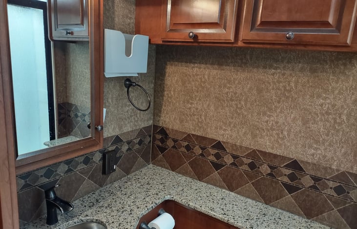 tons of counter space and storage cabinets in bathroom