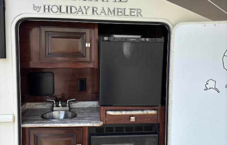 Outdoor Kitchen with sink, fridge and microwave