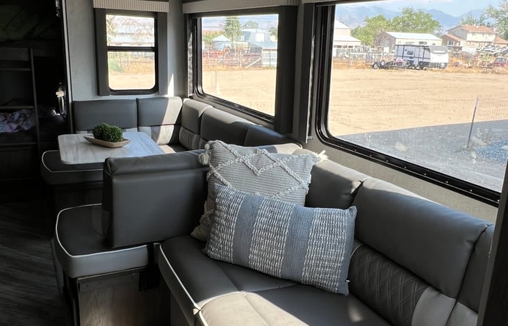 Large U shaped dinnett that turns into a bed, as well as the couch.