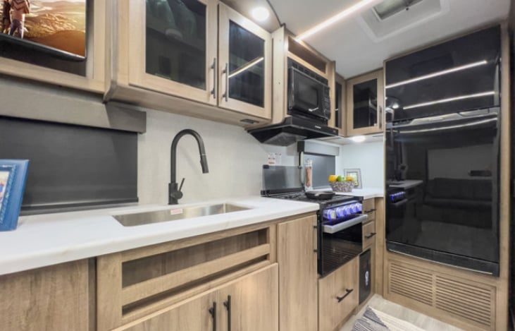 Coffee maker, toaster, crock pot, spices, pots/pans dishes, cups and silverware included.
Plenty of cabinet space. Large refrigerator. Oven and stove.