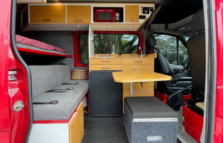 Ottoman / center table.  The table comes appart and stores as does the ottoman.