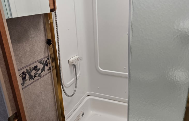 Bathroom has a nice removable shower head and there is even an outdoor spray for rinsing after a long day of fishing.