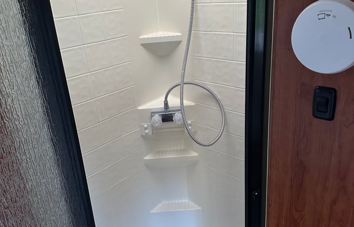 Shower, seperate from toilet and sink area (see floor plan photo)