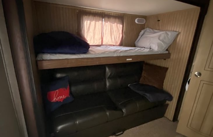 Bunk and folding couch on right side of the bunkhouse.