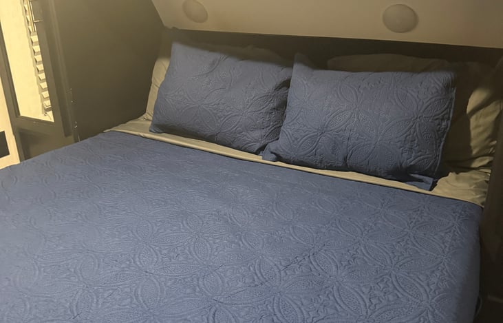 Queen bed with private suite.