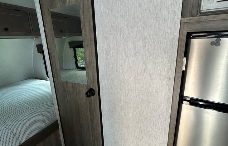Mirror and coat hooks.