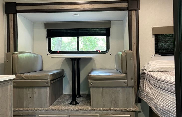 Dining table with storage underneath one of the seats