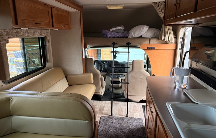 Slide IN..still very spacious. can fully use the kitchen while on the road.