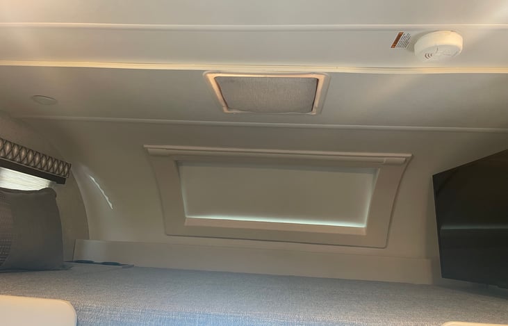 Cab-Over Sleeping Area with Cup Holders, and Telescoping Bunk Ladder