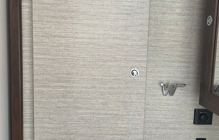 Clothes closet door is next to the medicine cabinet in the bathroom.