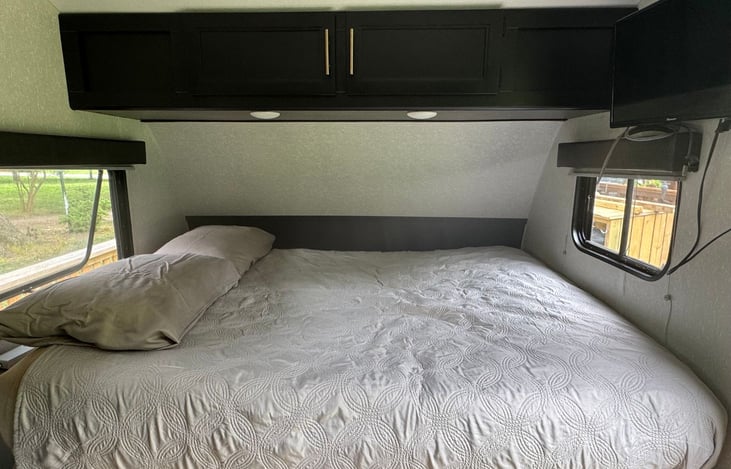 Cozy Queen sized bed with TV and HDMI cord for streaming