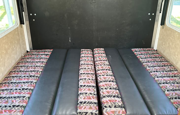 Both beds folded down. You can leave one up or fold them both down. Clean sheets are provided.