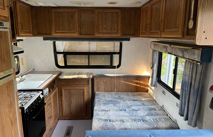 Kitchen table drop down to become a bed.