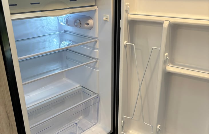 Small refrigerator with freezer compartment.