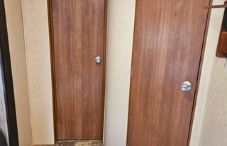 Large RV with outdoor kitchen, fireplace, and TVs